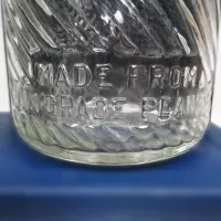 Jumbo Peanut Butter Vintage Embossed Clear Glass Jar: Back Closeup - Click to enlarge