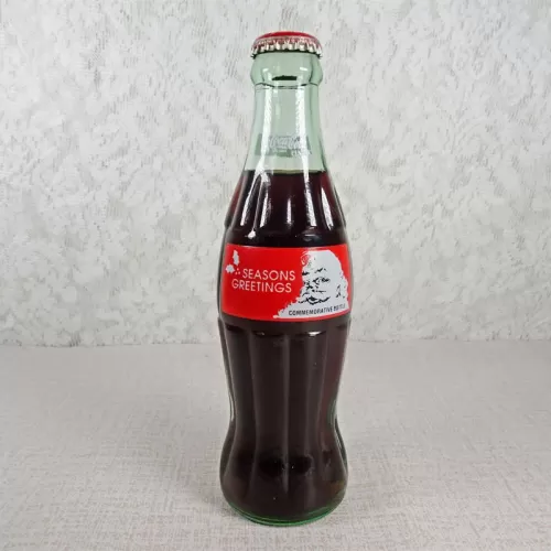 1991 Seasons Greetings 8 oz Full Coke Classic Bottle: Front