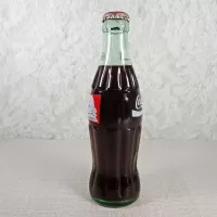 1991 Seasons Greetings 8 oz Full Coke Classic Bottle: Left - Click to enlarge