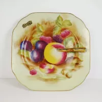 Decorative Plate with Finger Handle and Fruit Design: Top - Click to enlarge