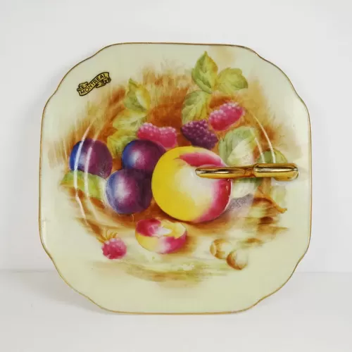 Decorative Plate with Finger Handle and Fruit Design: Top