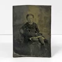 Antique Tintype Photo Little Girl Leaning Back in Chair: Front - Click to enlarge